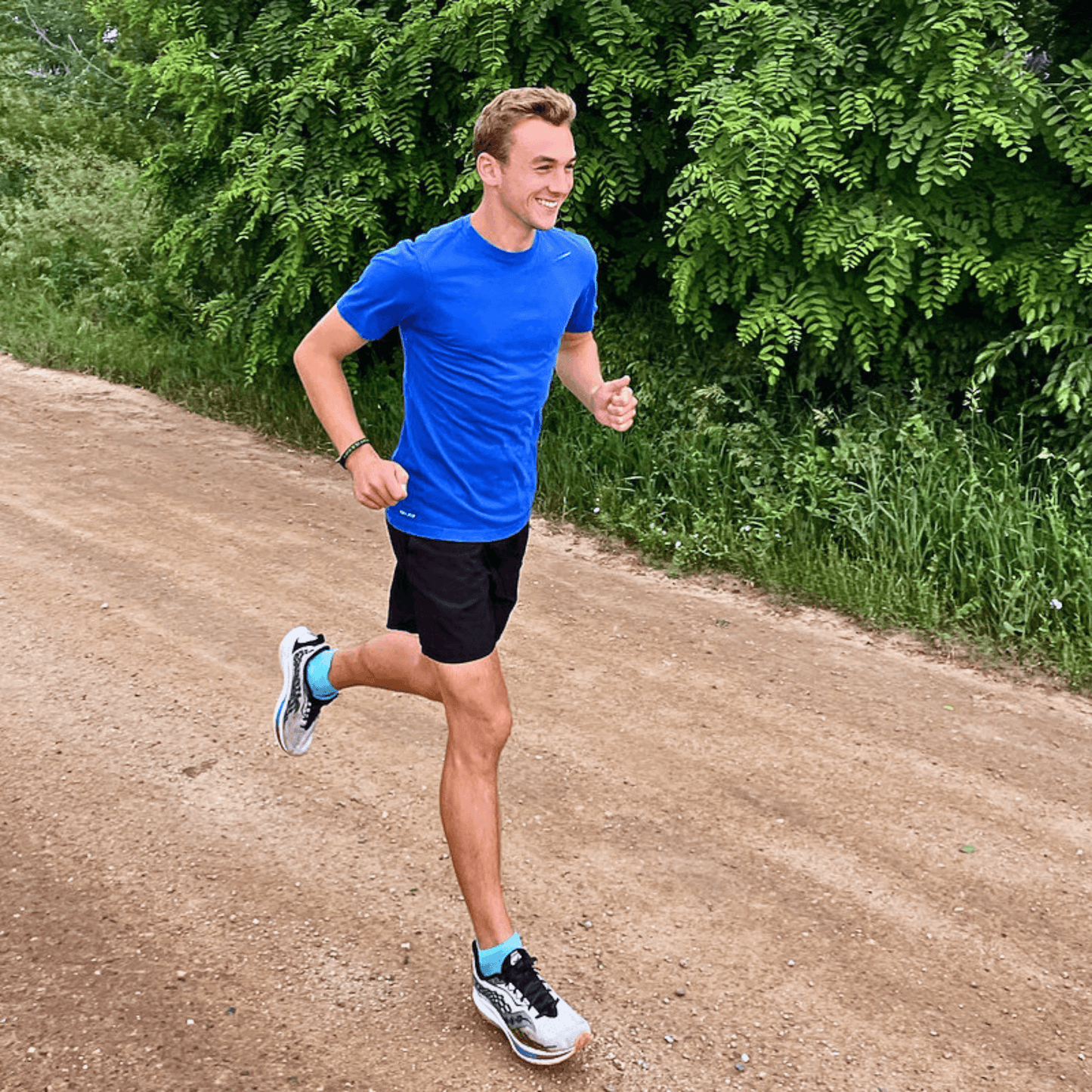 Male runner wearing SockMoose SpeedyMoose Ankle Tab 2.0 on dirt road