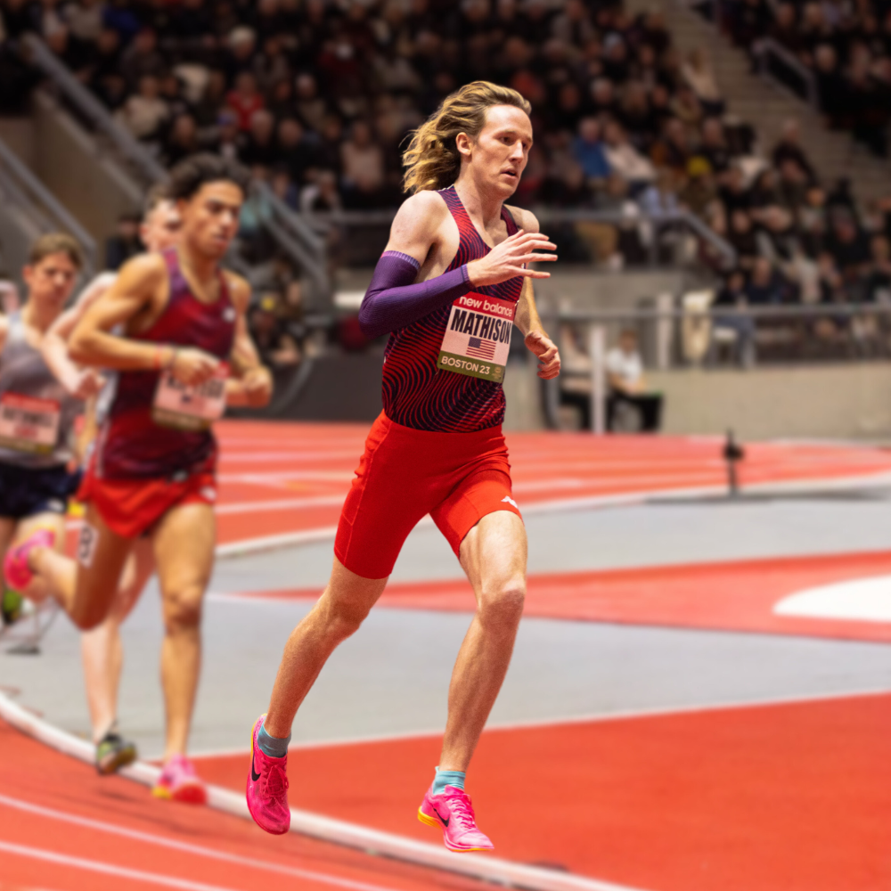 Male runner wearing SockMoose running socks on an indoor track